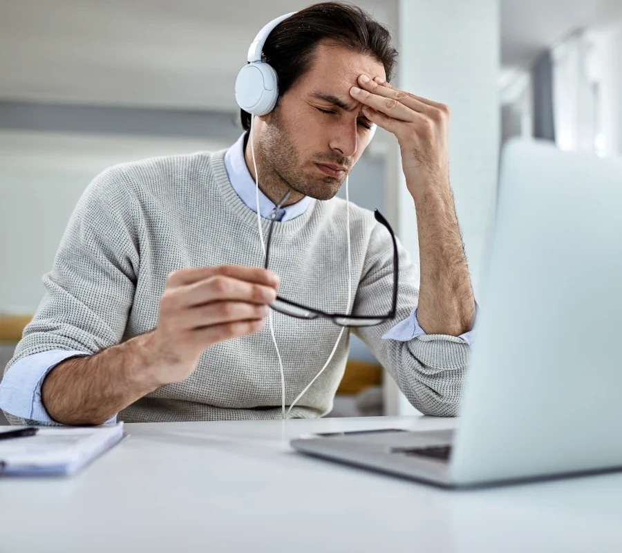 Local Service Ads 3 young businessman having headache feeling exhausted while working laptop home